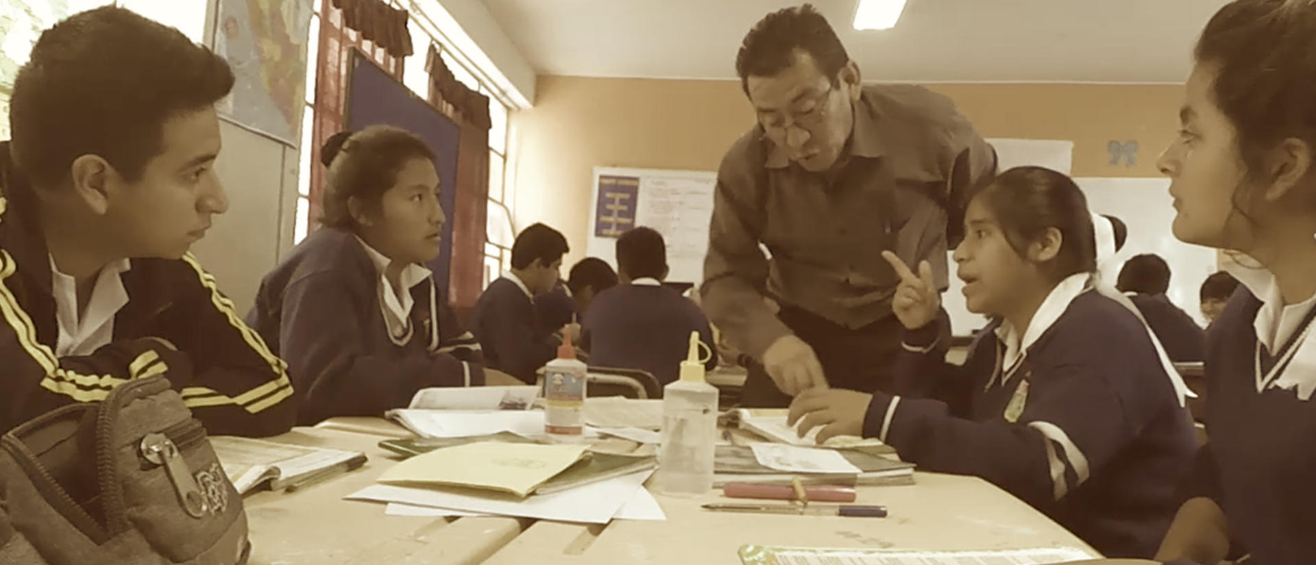 teacher with students in class, student speaking